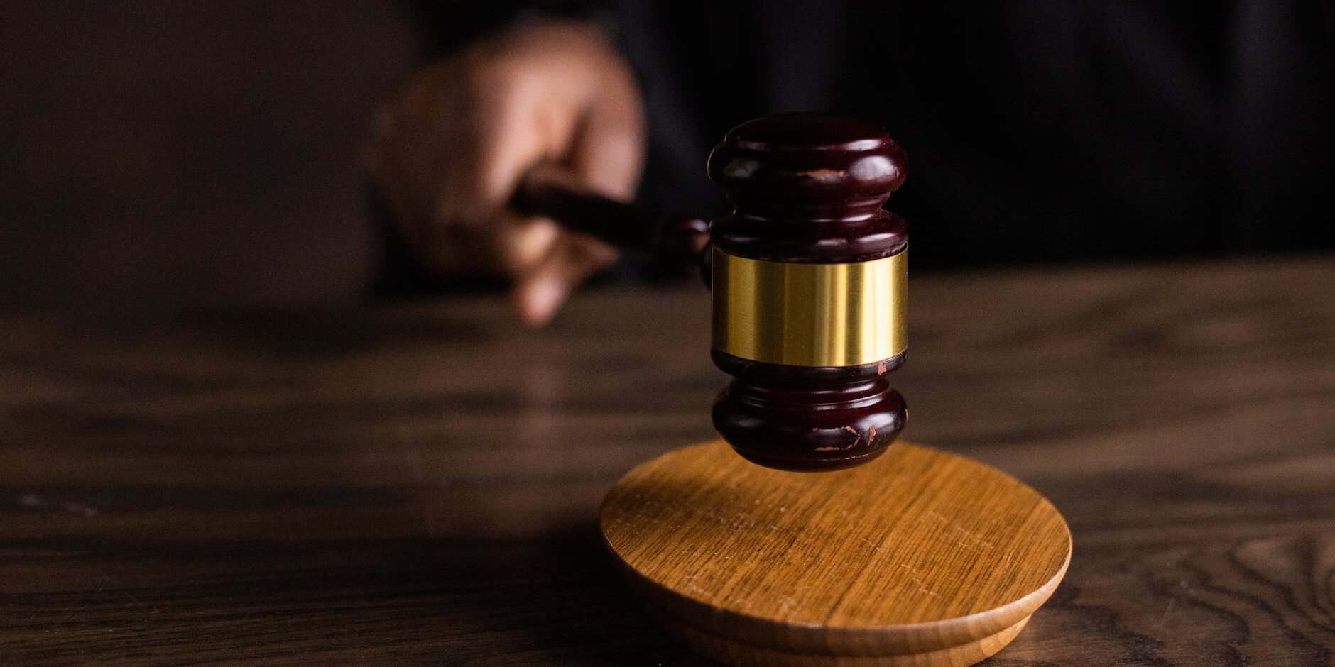 brown wooden gavel on brown wooden table
