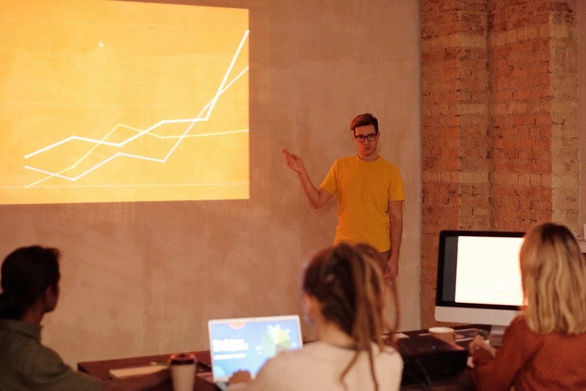 a man standing in front of the room