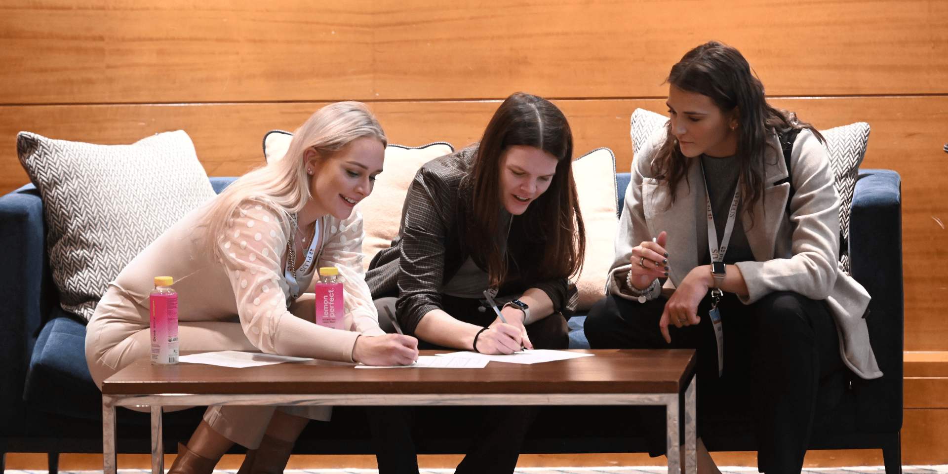 Image of members writing gratitude notes at the 2024 PLUS Conference
